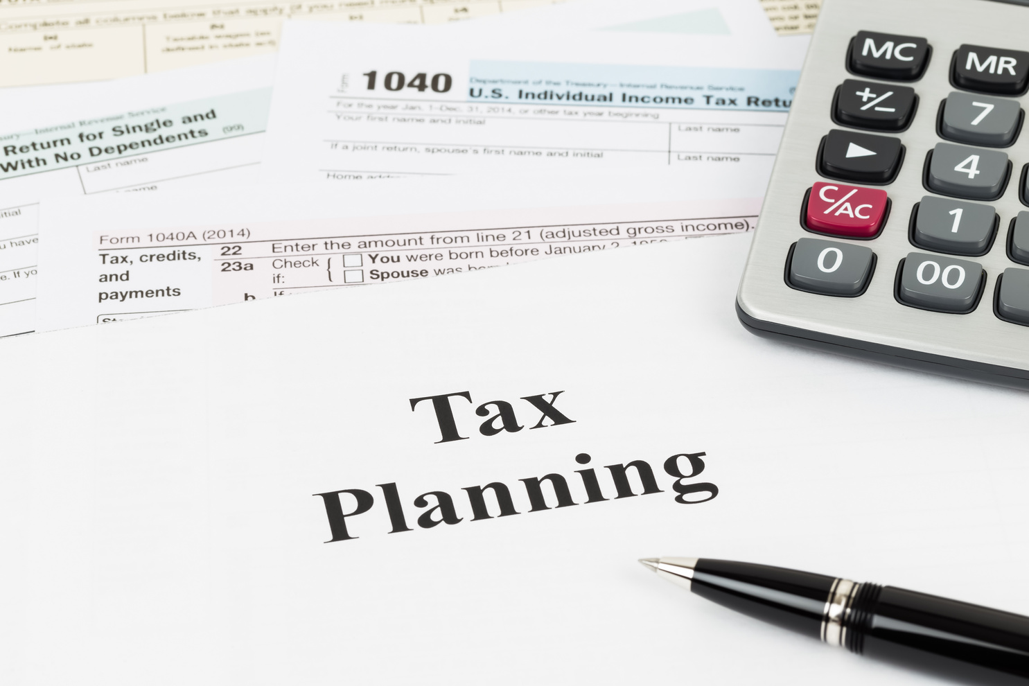 Tax planning wirh calculator taxation concept